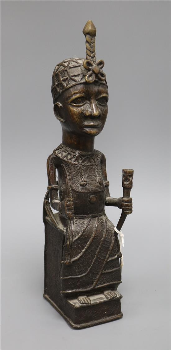 A Benin bronze of a seated man height 38cm